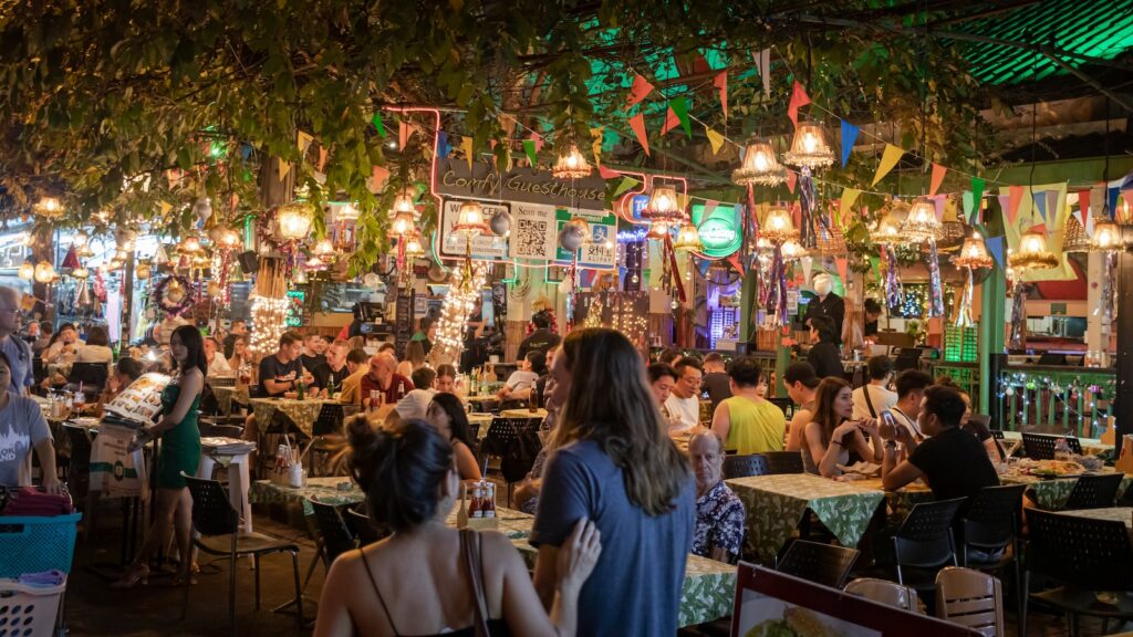 people sitting on chairs in a restaurant