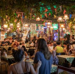 people sitting on chairs in a restaurant