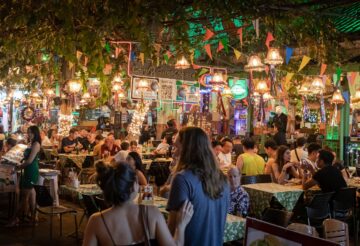 people sitting on chairs in a restaurant