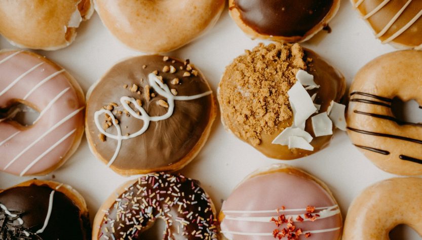 brown and white doughnuts on white tray