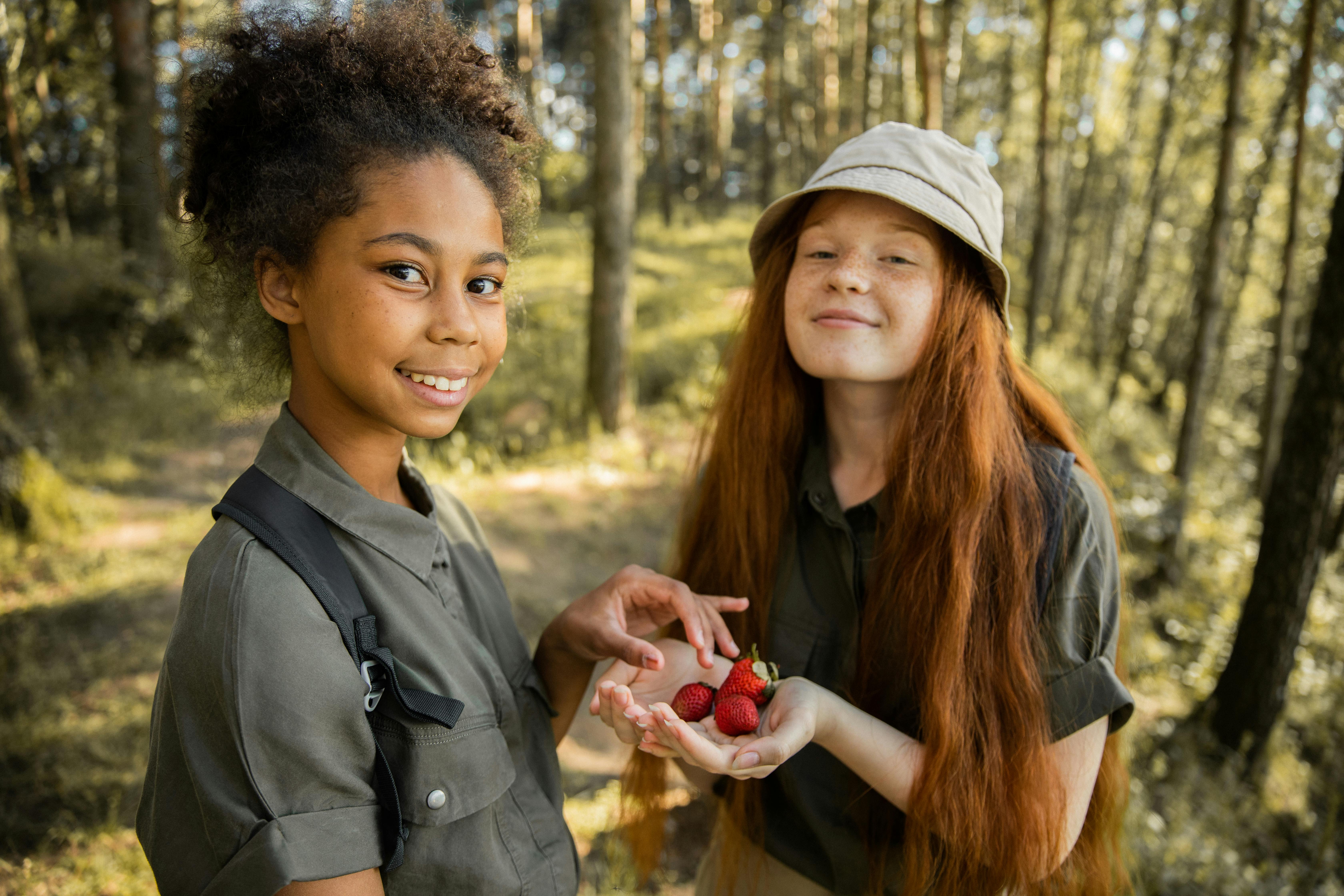 Kids eating strawberries at camp