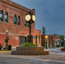 Charming brick building with unique street clock in Wabasha, Minnesota. Urban historic scene at dusk.