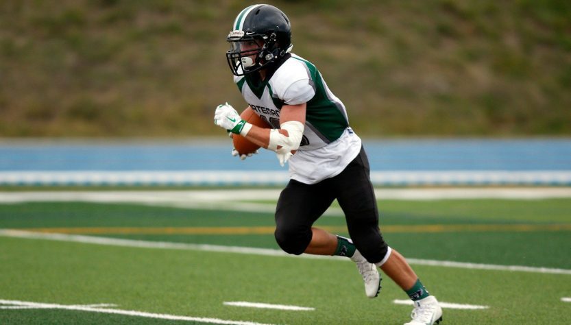 Forsyth County High School Football Schedules 1 Football Player running with ball