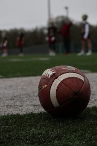 Forsyth County High School Football Schedules 2 a football sitting on top of a lush green field
