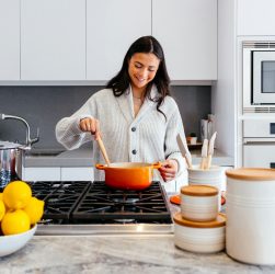 Stay Cool while cooking this Summer 1 woman cooking inside kitchen room