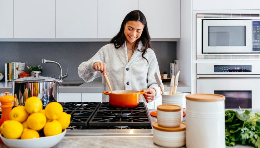 Stay Cool while cooking this Summer 1 woman cooking inside kitchen room
